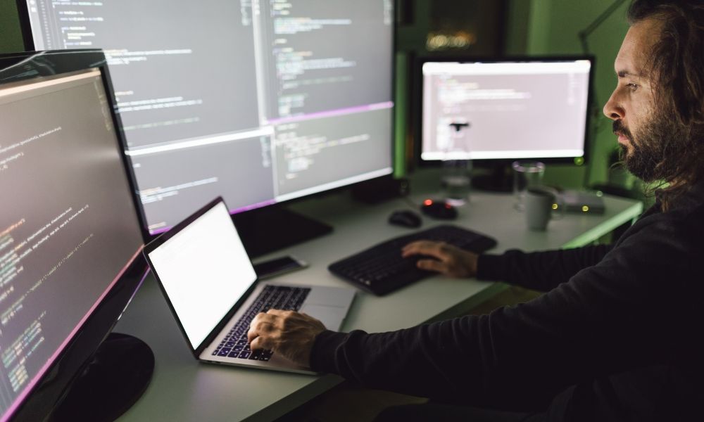Professional developer coding on computers